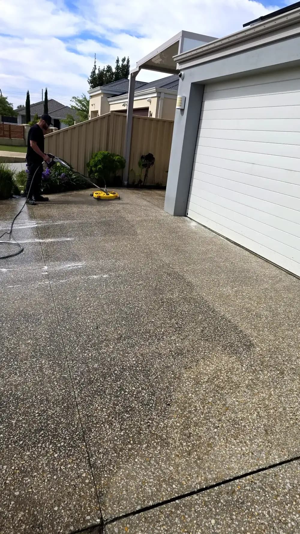 Pressure cleaning an exposed aggregate driveway with a rotary surface cleaner in Perth