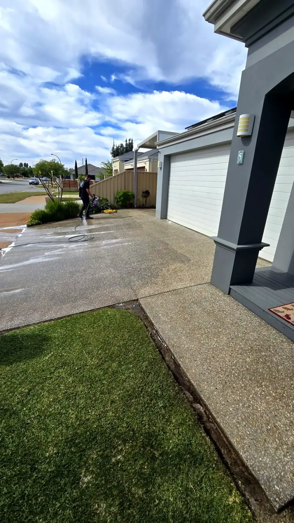 Cleaning a residential exposed aggregate driveway with a surface cleaner in Perth